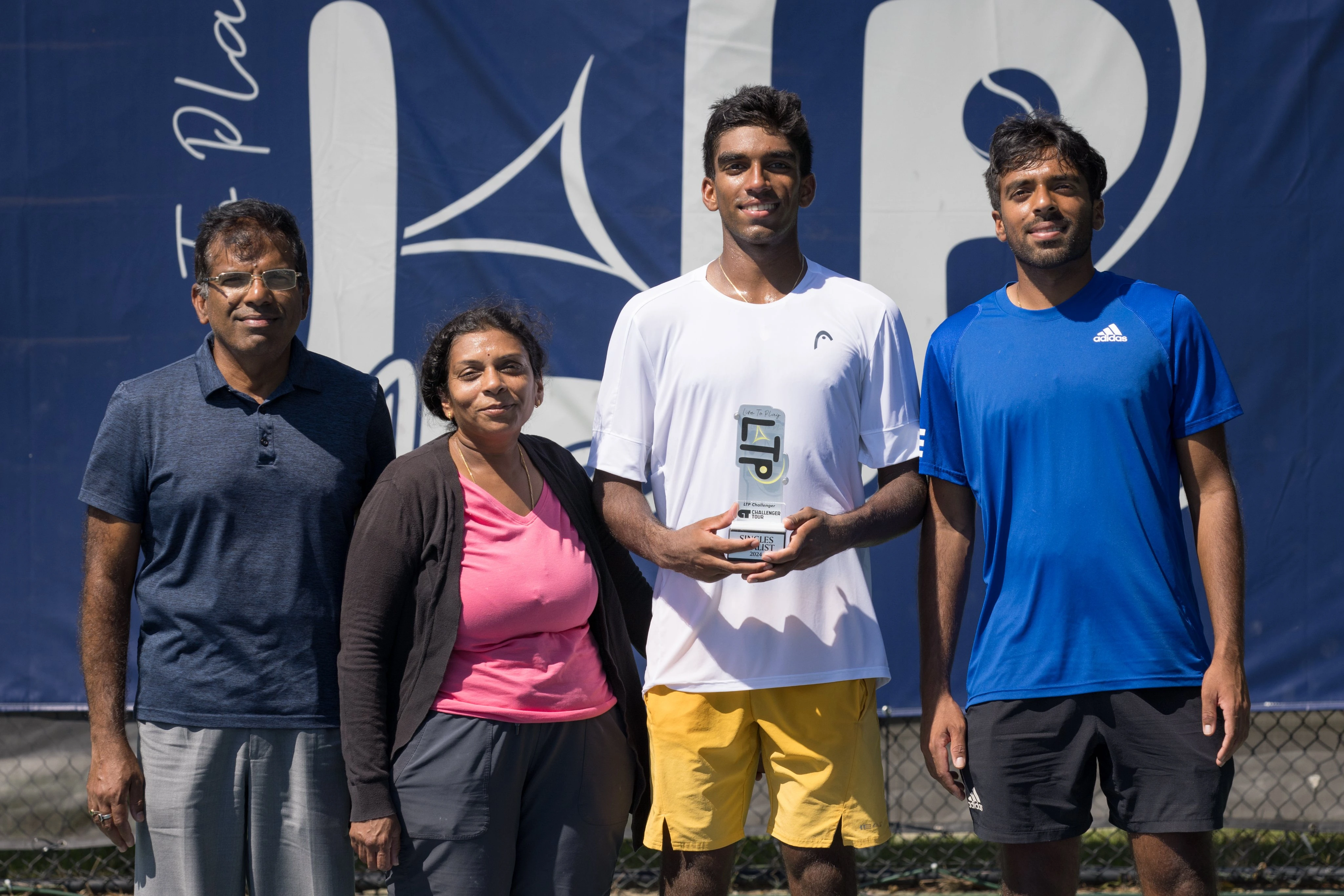 Nishesh Basavareddy with his parents and brother, Nishant